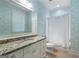 Bathroom featuring a granite countertop vanity, decorative wallpaper and tile flooring, blending functionality with unique design at 785 Wilson Nw Rd, Atlanta, GA 30318