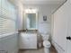Well lit bathroom featuring patterned wallpaper, single vanity, and a shower-tub combo at 785 Wilson Nw Rd, Atlanta, GA 30318