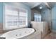 Bright bathroom with a luxurious soaking tub and a separate glass-enclosed shower at 785 Wilson Nw Rd, Atlanta, GA 30318