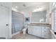 Clean bathroom with white cabinets, granite counters, a shower-tub combo, and a tile floor at 785 Wilson Nw Rd, Atlanta, GA 30318