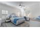 Comfortable bedroom with blue accents, plush bedding, and lots of natural light at 785 Wilson Nw Rd, Atlanta, GA 30318