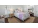 Charming bedroom with a cozy bed, woven rug, desk, and ample natural light at 785 Wilson Nw Rd, Atlanta, GA 30318