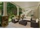 Inviting covered porch with stylish seating arrangement offering a comfortable outdoor living space, perfect for relaxation and gatherings at 785 Wilson Nw Rd, Atlanta, GA 30318
