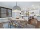 Eat-in kitchen with seating area, modern lighting, and light colored island with dark countertops at 785 Wilson Nw Rd, Atlanta, GA 30318