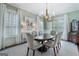 Elegant dining room featuring hardwood floors, custom lighting, and decorative artwork at 785 Wilson Nw Rd, Atlanta, GA 30318