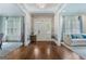 Elegant foyer with hardwood floors, decorative wallpaper, wainscoting and natural light at 785 Wilson Nw Rd, Atlanta, GA 30318