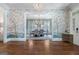 Inviting foyer leading to the dining room, featuring hardwood floors and stylish wallpaper at 785 Wilson Nw Rd, Atlanta, GA 30318