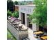 Outdoor seating at Howell's restaurant with umbrellas and greenery at 785 Wilson Nw Rd, Atlanta, GA 30318