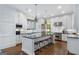 Gourmet kitchen featuring custom cabinets, stainless steel appliances, and large center island at 785 Wilson Nw Rd, Atlanta, GA 30318