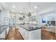 Open kitchen design with an island, stainless appliances, and dark countertops at 785 Wilson Nw Rd, Atlanta, GA 30318