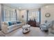 Sophisticated living room with custom millwork, plantation shutters, and designer furnishings at 785 Wilson Nw Rd, Atlanta, GA 30318