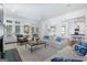 Bright living room with fireplace, open to the kitchen, and access to the porch at 785 Wilson Nw Rd, Atlanta, GA 30318