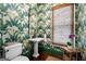 Charming powder room with patterned wallpaper, pedestal sink, and natural light at 785 Wilson Nw Rd, Atlanta, GA 30318