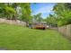 Spacious backyard featuring a well-maintained lawn and a charming home with a cozy deck at 1258 Campbellton Sw Rd, Atlanta, GA 30310
