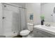 Bathroom featuring a shower with marble tile, a modern vanity, and a decorative art piece at 1258 Campbellton Sw Rd, Atlanta, GA 30310