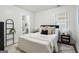 Cozy bedroom featuring neutral tones, soft textiles, and a stylish adjoining bathroom for a serene retreat at 1258 Campbellton Sw Rd, Atlanta, GA 30310