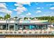 Exterior view of a vibrant food hall with outdoor seating, modern architecture, and inviting ambiance at 1258 Campbellton Sw Rd, Atlanta, GA 30310