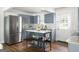 Well-appointed kitchen features stainless steel appliances, light-blue cabinetry, and a functional island for added prep space at 1258 Campbellton Sw Rd, Atlanta, GA 30310