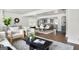 Open-concept living area with a modern design aesthetic, hardwood floors, and seamlessly flowing spaces at 1258 Campbellton Sw Rd, Atlanta, GA 30310