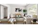 Bright living room with neutral décor, hardwood floors, and a stylish console table beneath a large window at 1258 Campbellton Sw Rd, Atlanta, GA 30310