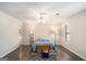 Cozy bedroom with hardwood floors, soft lighting, and a tranquil atmosphere, perfect for relaxation at 149 Crown Oaks Dr, Stockbridge, GA 30281