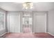 Bedroom with a large window, double closets, and neutral walls at 149 Crown Oaks Dr, Stockbridge, GA 30281