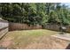 Fenced backyard featuring a small patio and a grill at 2780 Lakeview Walk, Decatur, GA 30035