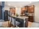 Spacious kitchen island with granite countertop, stainless appliances, tile flooring, and wood cabinets at 2780 Lakeview Walk, Decatur, GA 30035