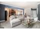 Open-concept living room with a large sectional sofa and seamless flow to kitchen at 2780 Lakeview Walk, Decatur, GA 30035