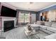 Open-concept living room with a large sectional sofa, fireplace, and natural light at 2780 Lakeview Walk, Decatur, GA 30035