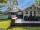 This well-maintained backyard features a built-in wooden seating and grill at 30 Court, Ellenwood, GA 30294
