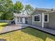 Inviting backyard deck made of dark wood, perfect for outdoor relaxation, in a well-maintained yard at 30 Court, Ellenwood, GA 30294