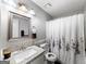 This guest bathroom features a single sink granite vanity, toilet, and tub/shower at 30 Court, Ellenwood, GA 30294