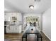 Bright dining area off kitchen has hardwood floors and lots of natural light at 30 Court, Ellenwood, GA 30294