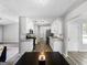 An open kitchen with white cabinets, granite countertops, and stainless steel appliances for modern living at 30 Court, Ellenwood, GA 30294
