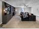 Spacious living room with custom built-in shelving and soft lighting is perfect for entertaining guests at 30 Court, Ellenwood, GA 30294