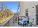 Inviting balcony with comfortable seating and scenic views of the surrounding trees at 420 Heritage Park Nw Trce # 22, Kennesaw, GA 30144