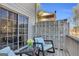 Cozy balcony with outdoor seating, perfect for enjoying a relaxing evening at 420 Heritage Park Nw Trce # 22, Kennesaw, GA 30144