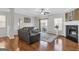 Inviting living room featuring hardwood floors, fireplace, and sliding glass doors at 420 Heritage Park Nw Trce # 22, Kennesaw, GA 30144