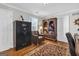 A charming office space with hardwood floors, built-in shelving and a comfortable leather chair at 420 Heritage Park Nw Trce # 22, Kennesaw, GA 30144