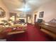 Cozy living room with elegant decor, a fireplace, plush furnishings, and soft lighting, creating a welcoming atmosphere at 7133 Babbling Brook Dr, Jonesboro, GA 30236