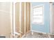 Bathroom featuring new plumbing in wall framing ready for tile and construction with a bright window at 2522 Frost Sw Dr, Marietta, GA 30008