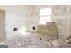 Bedroom featuring bright window, primed walls, and exposed flooring ready for remodel and your design ideas at 2522 Frost Sw Dr, Marietta, GA 30008