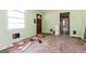 Under-renovation living room shows potential, featuring a large window and freshly painted walls at 2522 Frost Sw Dr, Marietta, GA 30008