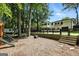 Spacious backyard with a playground, trampoline, and privacy fence bordering a well-maintained two-story home at 2676 Cottonwood Dr, Marietta, GA 30066