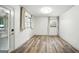 Bright basement area with wood-look floors, large windows, and outdoor access at 2676 Cottonwood Dr, Marietta, GA 30066
