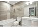 Updated bathroom featuring a tub, shower, and modern white vanity with a sleek sink and gray tiling at 2676 Cottonwood Dr, Marietta, GA 30066