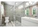 Modern bathroom featuring a glass shower with gray horizontal tile and a white vanity with a vessel sink at 2676 Cottonwood Dr, Marietta, GA 30066