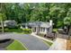 Charming single-story home with a circular driveway, lush landscaping, and manicured flowerbeds enhancing curb appeal at 2676 Cottonwood Dr, Marietta, GA 30066