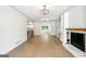 Inviting living room with hardwood floors and brick fireplace with built-in shelves at 2676 Cottonwood Dr, Marietta, GA 30066
